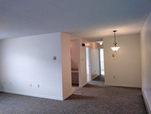 View of Living Room and Dining Room of this large 2 bedroom apt